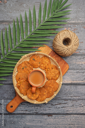 Thattai or Nippattu or Chekkalu is a south Indian deep fried snack made with rice flour prepared during festive and daily common snack.  Thattai is a south Indian fried snack, Spicy and Crispy.. photo