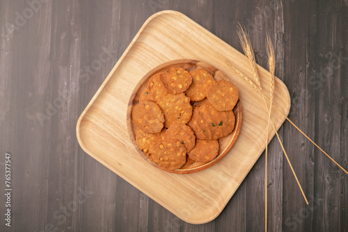 Obraz na płótnie Thattai or Nippattu or Chekkalu is a south Indian deep fried snack made with rice flour prepared during festive and daily common snack. Thattai is a south Indian fried snack, Spicy and Crispy w salonie