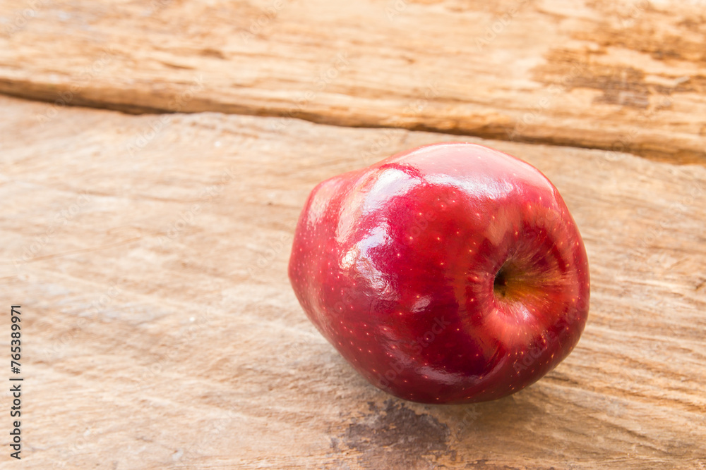 Fresh red apple on a wooden table background Fresh red apple on a wooden table background