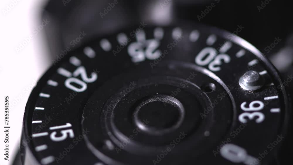 Smooth close up rotation of frame counter dial of old vintage analog photo camera