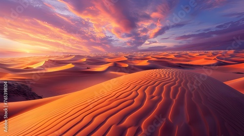The view of the desert expanses in the sunset light is a true sight: golden sand dunes and the reflection of sunset colors on the horizon create amazing harmony and peace.
