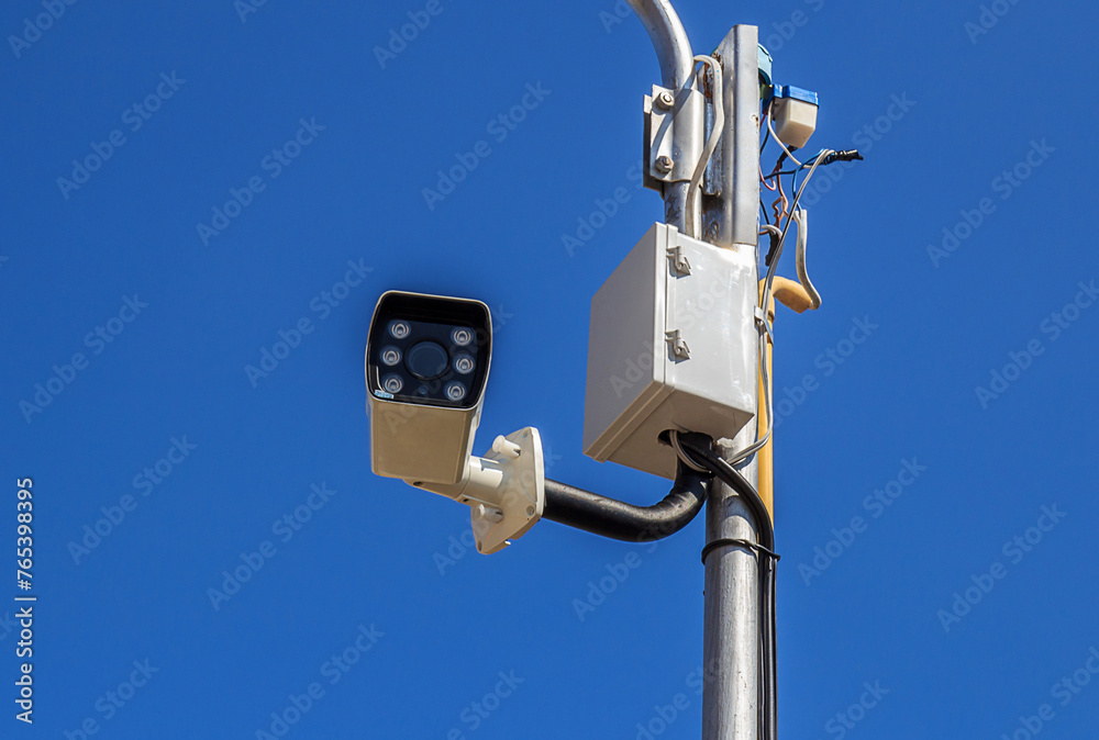 The security camera against blue sky The security camera against blue sky