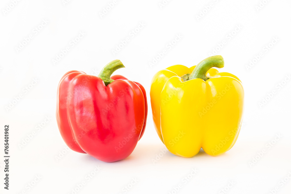 Red and yellow bell pepper on white background