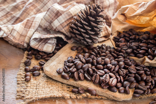 Coffee beans on wooden table background