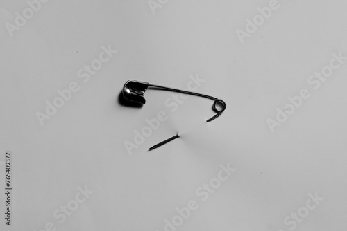 a safety pin isolated on a white background photo