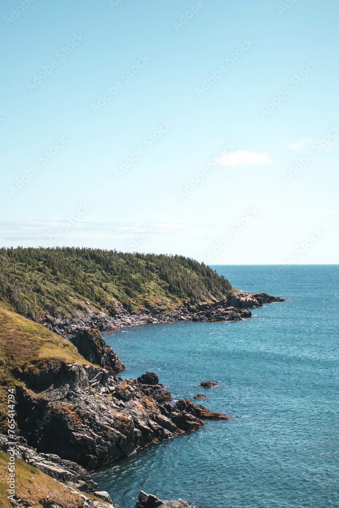Rocky coastal landscape surrounded by blue ocean