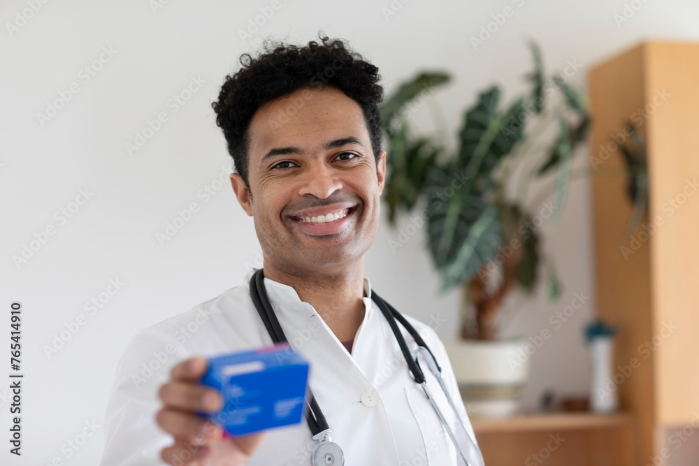 doctor, male, mixed race in a practice doctor, male, mixed race in a practice