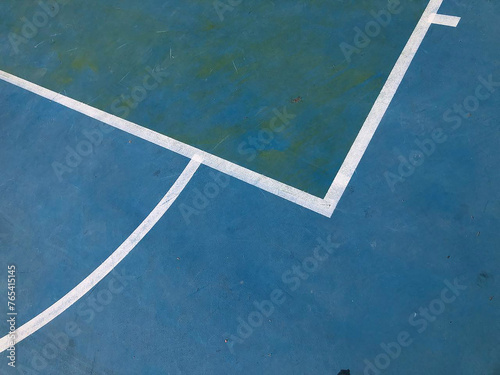 bright blue floor outdoor basketball court © Cavan