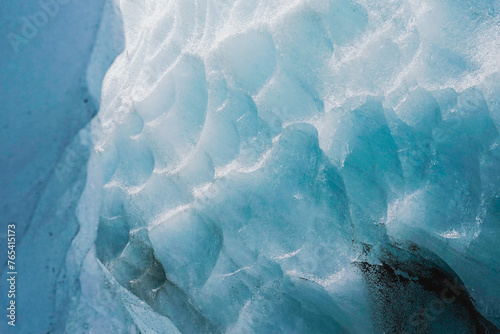 Textured blue ice wall from inside an Icelandic glacier photo