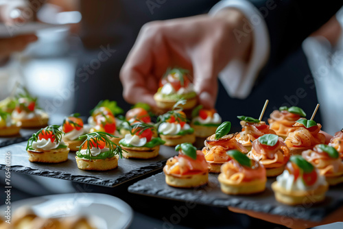 Man hand taking canape served on celebration event
