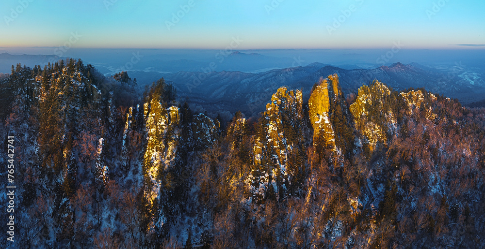 Aerial photography of the sunrise at the peak of Xiaoxing'an Mountains in winter