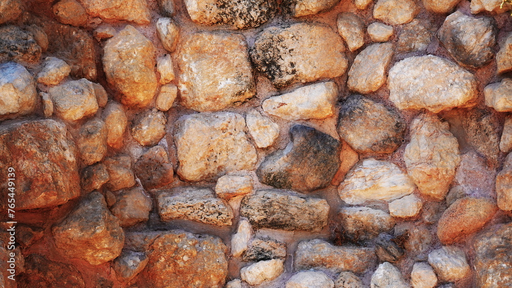 Warm Tones Rustic Stone Wall Texture Sunlit Close-Up Horizontal Background Warm Tones Rustic Stone Wall Texture Sunlit Close-Up Horizontal Background