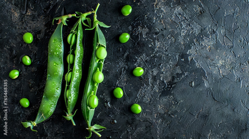 Green peas and pea pods on dark background. Top view. Free space for text. - obrazy, fototapety, plakaty 