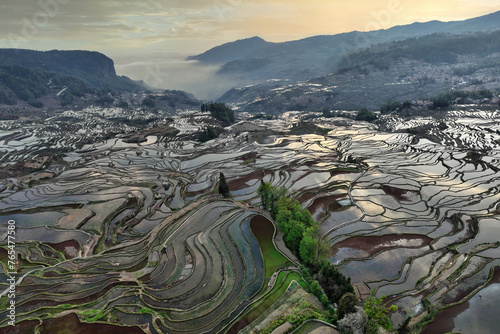 Aerial view of Yuanyang rice terraces filled with water in Yunnan - China, Unesco World Heritage Site