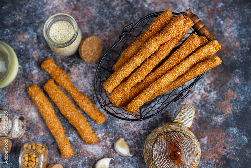 Italian grissini or salted bread sticks with sesame seeds.