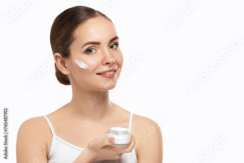 Beauty Skin Woman Natural Makeup Face Cosmetic Concept.Beautiful Portrait Of Female Face Holding And Applying Cosmetic Cream. Skin Care.