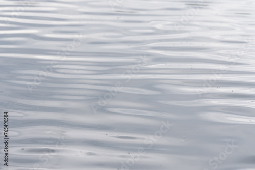 Closeup of lake water surface with wind ripples