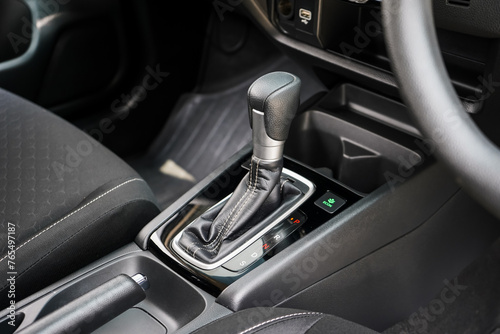 automatic transmission shift selector in the car interior. Closeup a manual shift of modern car gear shifter. 4x4 gear shift   © Muanpare