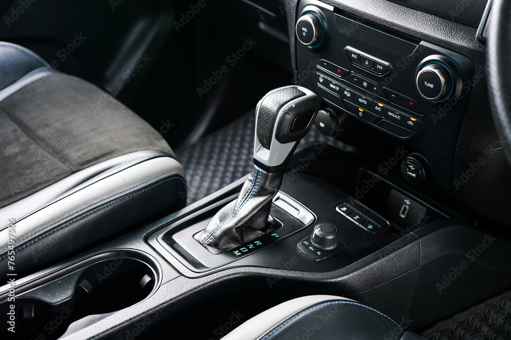 automatic transmission shift selector in the car interior. Closeup a manual shift of modern car gear shifter. 4x4 gear shift
automatic transmission shift selector in the car interior. Closeup a manual shift of modern car gear shifter. 4x4 gear shift