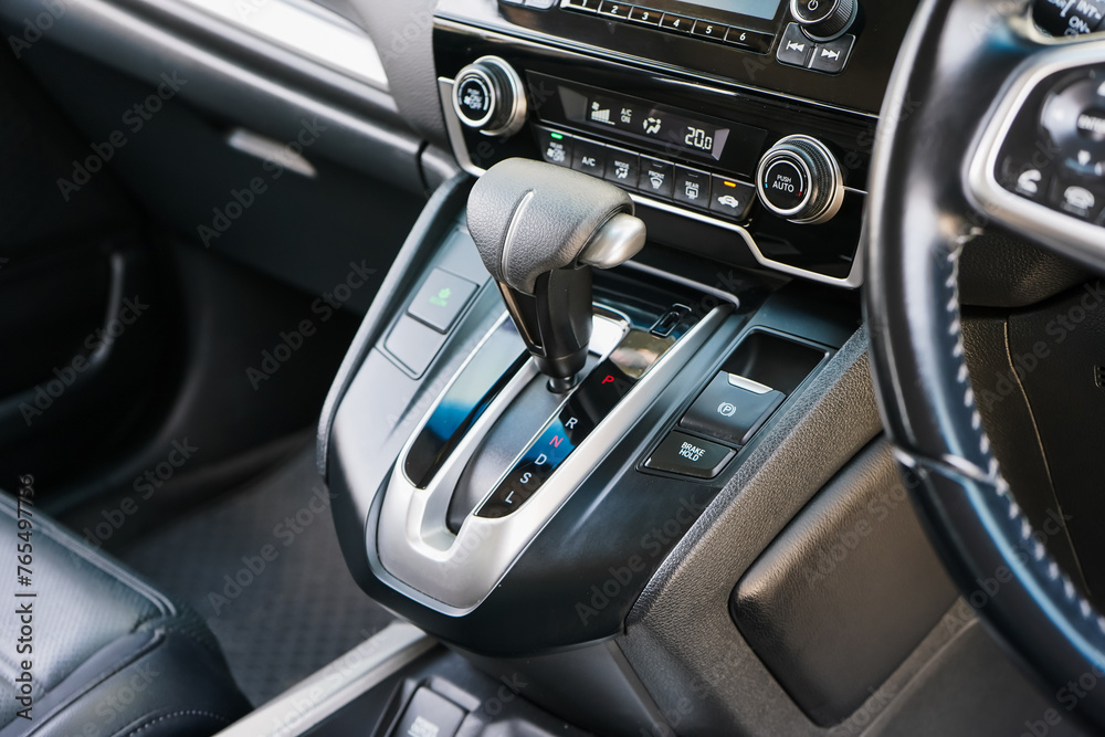 automatic transmission shift selector in the car interior. Closeup a manual shift of modern car gear shifter. 4x4 gear shift	
