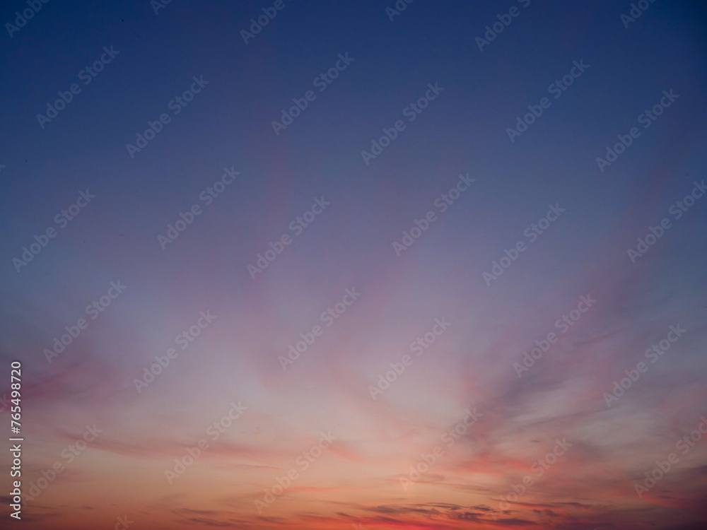 Calm blue and orange sunset sky. Background for design and replacement.