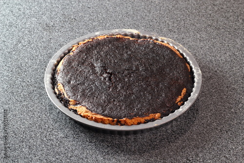Freshly baked pie in tin. Making Treacle Pie Series. © ffolas