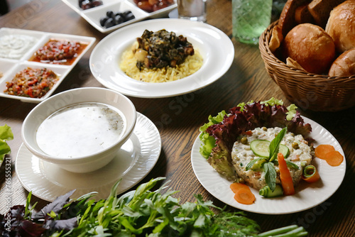 Wooden Table Holding a Variety of Deliciously Prepared Food