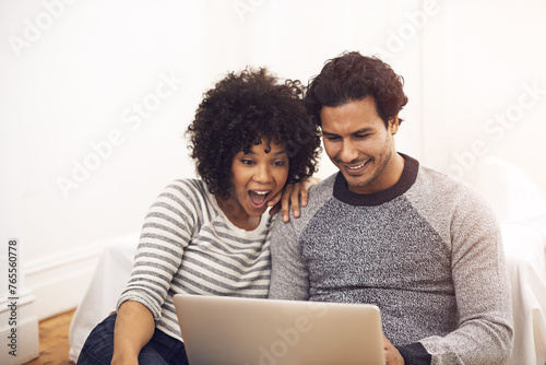 Couple, laptop and living room with lounge, smile and love for home or house date. Man, woman and technology for surprise, shock and social media for bonding and happy relationship or marriage