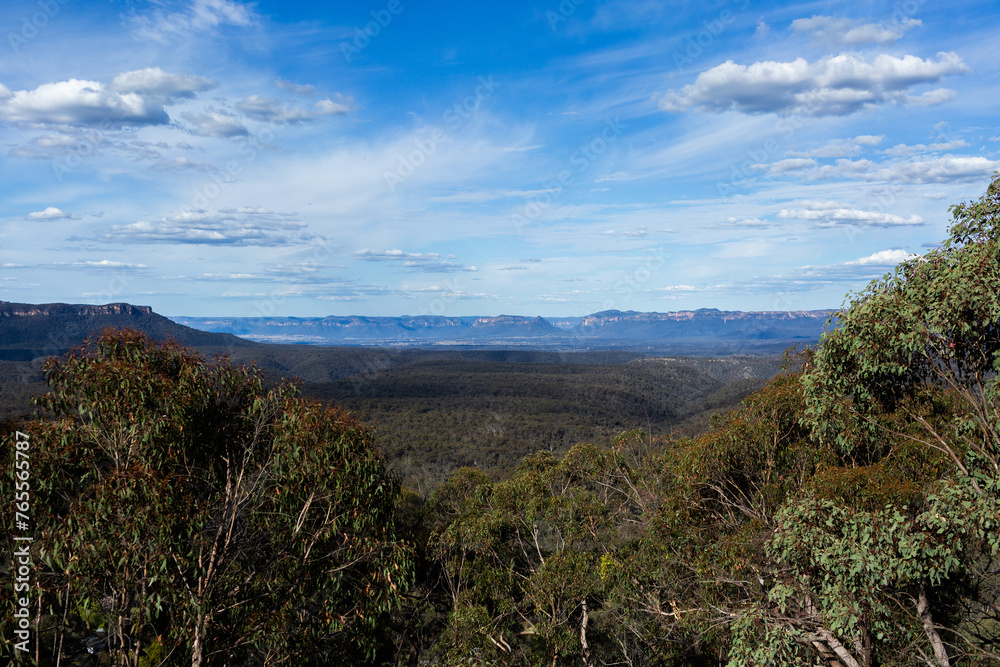 View over Capertee valley through eucalyptus trees View over Capertee valley through eucalyptus trees