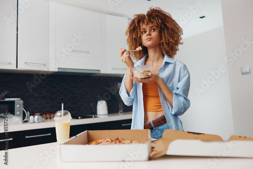 CurlyHaired Woman Indulging in Delicious Pizza Slice in Front of Pizza Box with Appetizing FoodtextAligns