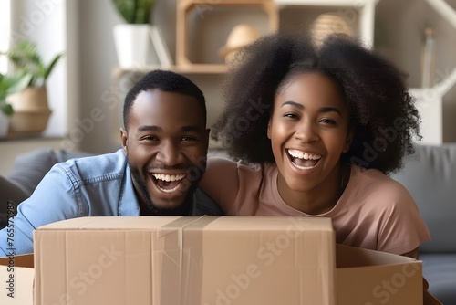 Domestic Delight: Happy Couple of Homeowners Engaged in Unpacking Cardboard Boxes, Embracing the Thrill of Settling into Their New Residence