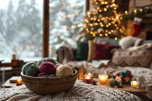 a wooden bowl with woolen yarn balls inside standing on atable in a cozy living room at christmas time, outside is a snow covered landscape, still life photo