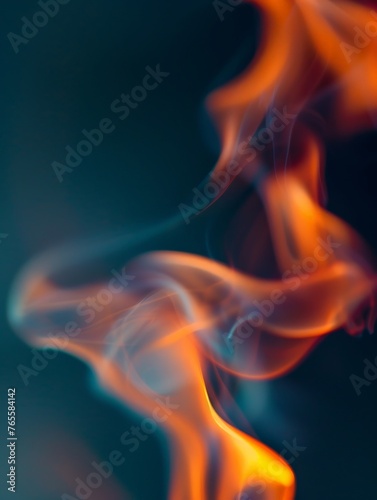 A blurred fire burning intensely against a dark black background, creating a dynamic and dramatic visual effect © pham