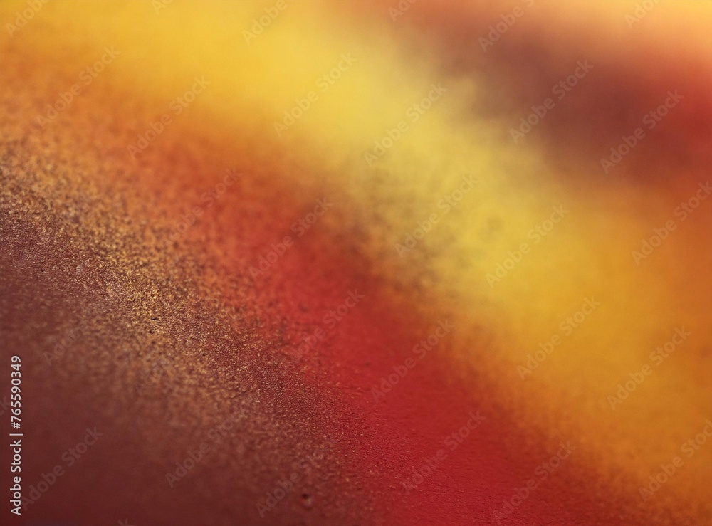 Grainy brownish red and yellow unfocused background texture