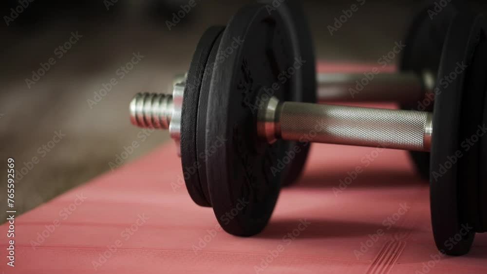 Various exercise equipment on a mat 