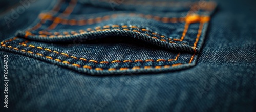 A detailed view of a fashionable pair of blue jeans, showcasing the texture and stitching of the denim fabric.