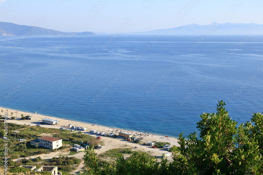 Obraz premium Aerial view of Borshit beach. Qazim Pali cityscape. Colorful seascape of Adriatic sea, Albania