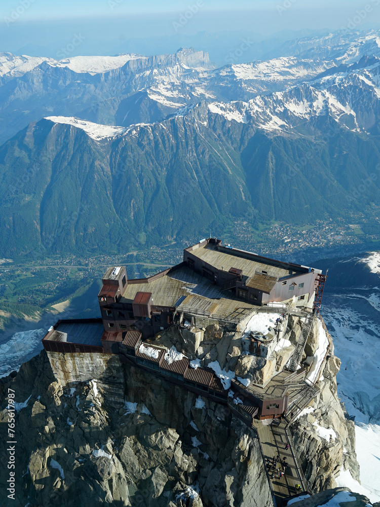 Aiguille du Midi station aerial view above Chamonix, popular tourist and mountaineers landmark, French Alps