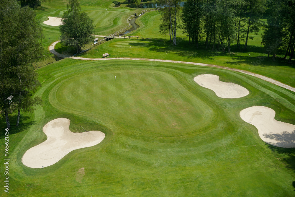 Luxurious beautiful golf course with well prepared green, fairway and bunkers, aerial panoramic view, Chamonix, France