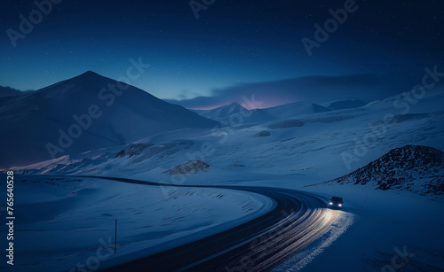 Lonely car on a curvy mountain road, gloomy winter atmosphere