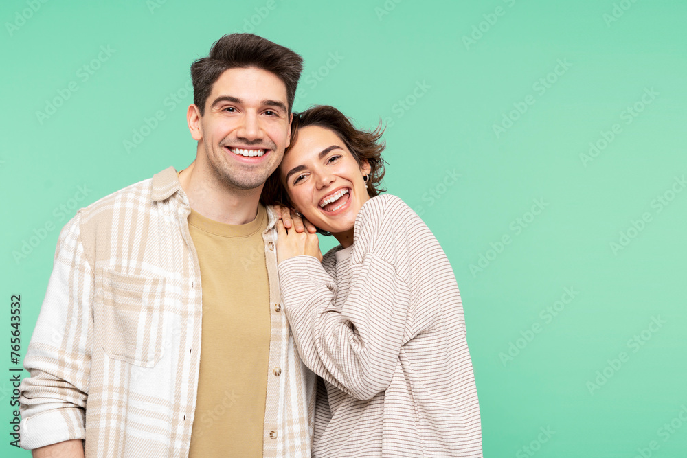 Portrait of smiling, beautiful people, young man and woman, friends embracing, looking at the camera Portrait of smiling, beautiful people, young man and woman, friends embracing, looking at the camera