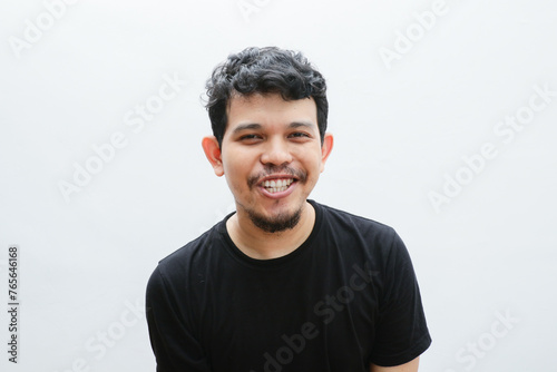 a smiling asian man with a funny face