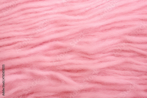 Textura de lana rosa vista de cerca.