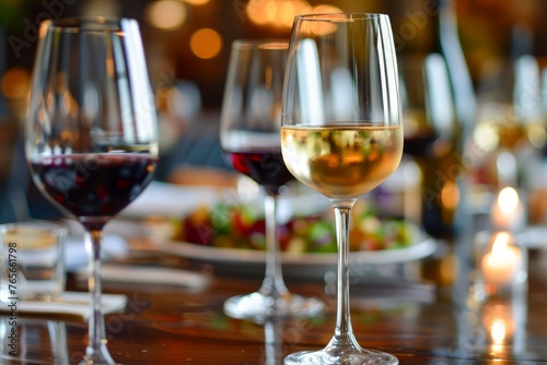 Elegant Dining Setting with Red and White Wine Glasses on a Restaurant Table, Soft Lighting, and Blurred Background