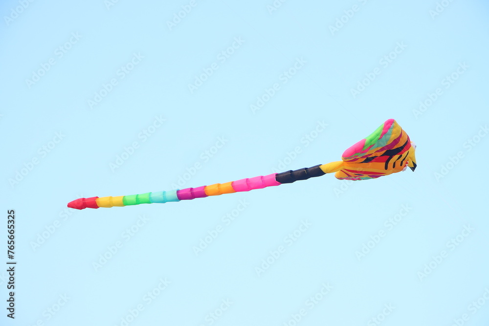 Colorful kite flying in the clear blue sky in summer in Mekong Delta Vienam. Colorful kite flying in the clear blue sky in summer in Mekong Delta Vienam.