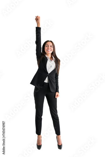 A young woman posing as a superhero with one arm raised triumphantly, dressed in business attire, against a white background © Who is Danny