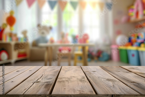 Wooden table in a colorful and bright playroom with toys and a chalkboard in the background.