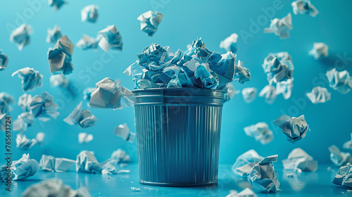 Close-up of a small trash bin overflowing with crumpled paper, symbolizing rejected ideas and the iterative process of innovation photo