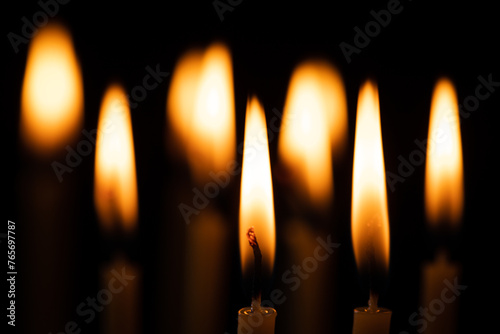 Burning candles on a black background