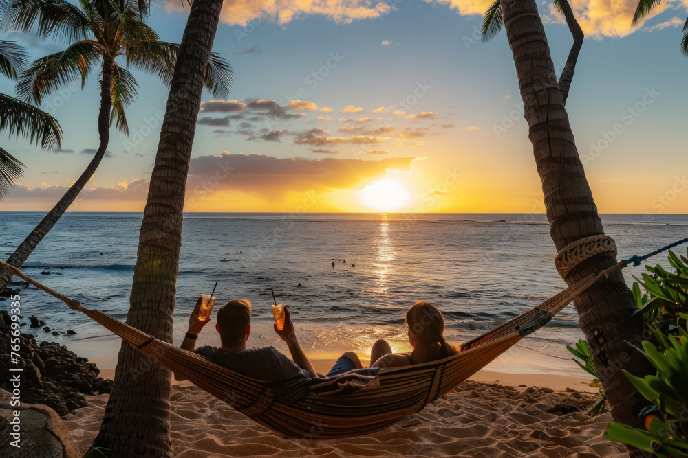 Couple Enjoying a Tropical Sunset from a Hammock on the Beach